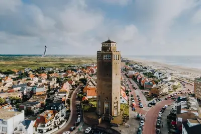 an aerial view of a city with a clock tower at Green Happiness With Private Parking in Zandvoort