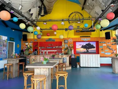 a restaurant with a table and stools in a room at Apartment Penthouse by Interhome in Uitgeest