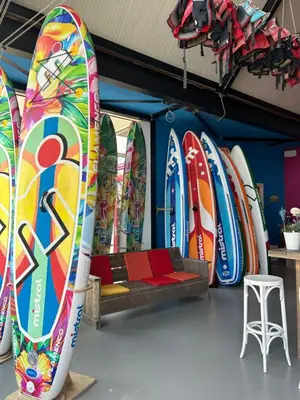 a bunch of surfboards are lined up in a room at Holiday Home De Meerparel-1 by Interhome in Uitgeest