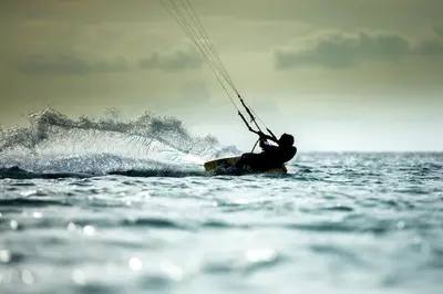 a man on a surfboard in the water at Zee & Zo in Zandvoort