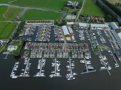 an aerial view of a parking lot with boats at Holiday Home Havenlodge by Interhome in Uitgeest
