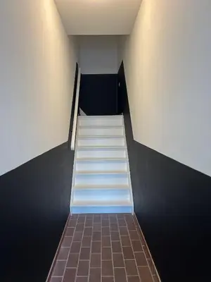 a staircase in a building with white steps at Pure Studio in Zandvoort