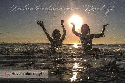 two girls in the water with a fire in their hands at Have a nice stay! - Raaff-71 sfeervol huis direct bij bos, duin en strand in Noordwijk