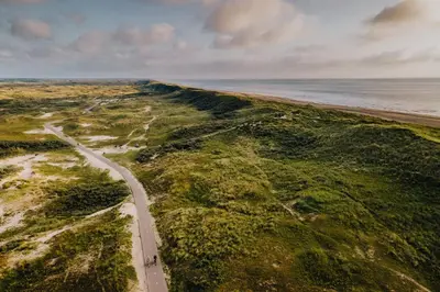 an aerial view of a road next to the ocean at Casa by Sellas in Zandvoort