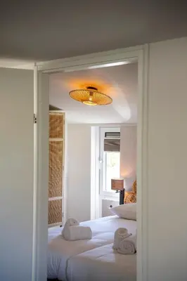 a bedroom with two beds with towels on them at Buiten aan zee by Droomvilla in Sint Maarten