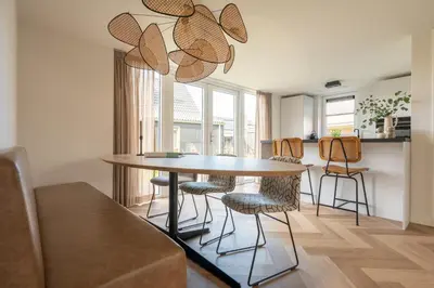 a dining room with a table and chairs at Ultiem genieten in Sint Maarten by Droomvilla in Sint Maarten