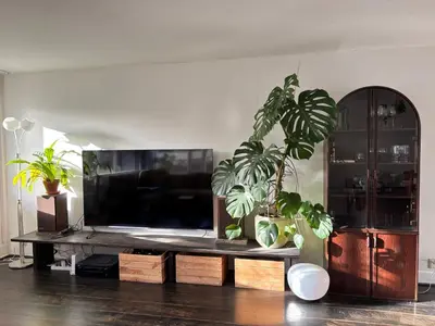 a living room with a large flat screen tv at Lovely City Center Apartment in Alkmaar