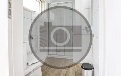 a bathroom with a shower with a round mirror at Amazing Ship In Aalsmeer in Aalsmeer