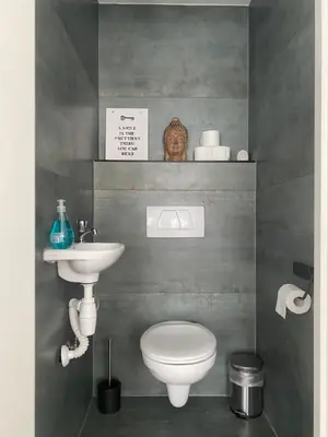 a bathroom with a toilet and a sink at Studio Romantic in Zandvoort