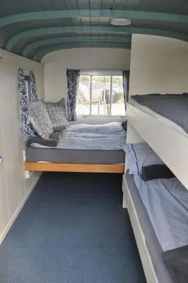 a bedroom with two bunk beds and a window at The Cuckoo's nest in Amsterdam