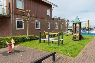 a park with a playground with a play equipment at Meerzicht 99 - Luxury house 30 minutes from Amsterdam in Uitgeest